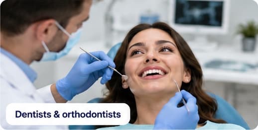 Dentist treating a smiling patient